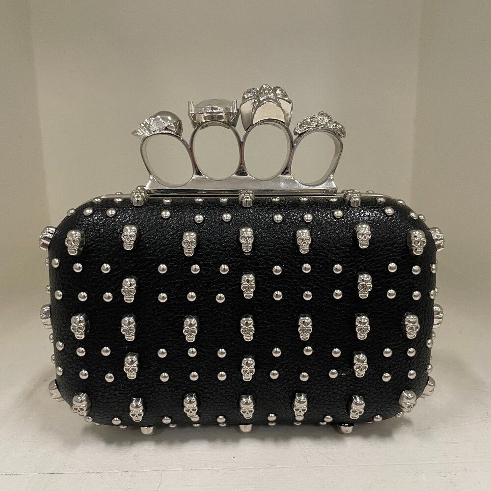 New knuckle clutch with all over skull studs